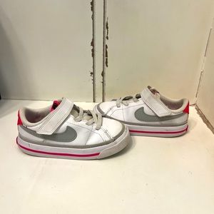 Pink and white Nikes